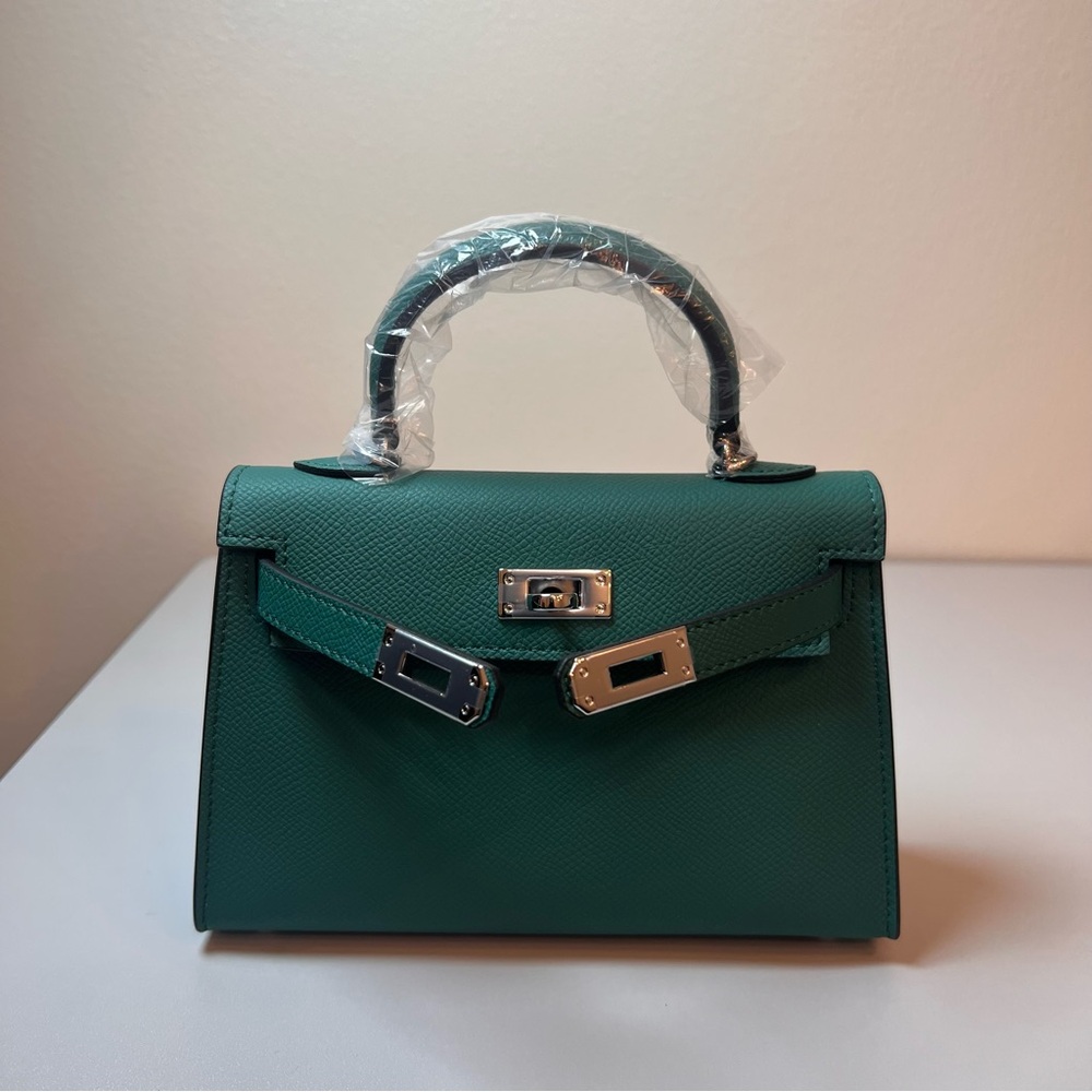 Genuine Epsom Leather mini handbag with shoulder strap featuring Silver hardware